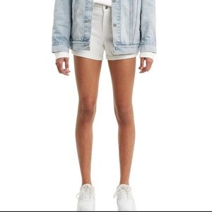 Levi’s mid length distressed white shorts
